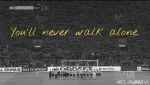 多特球迷高举围巾,高唱《You Never Walk Alone》